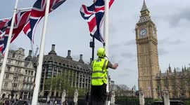 Worker install Union Jacks in Parliament Square