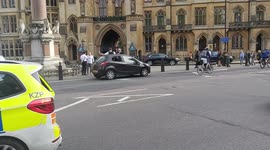 Car in Westminster's Parliament Square seen with broken window after controlled explosion
