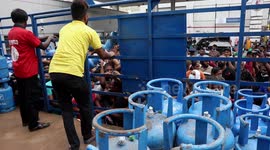 Sri Lanka’s prime minister resigns amid protests over economic crisis as looters grab cylinders