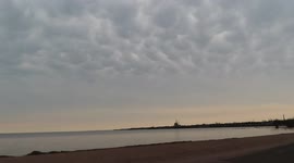 Mammatus clouds hover over calm waters of Lake Superior in Wisconsin