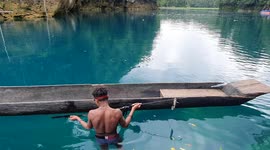 Diving and Shooting Fish in Lake Uter, Maybrat West Papua , Indonesia