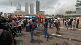 Curfew imposed in Sri Lanka after political clashes in capital and resignation of PM