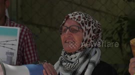 Palestinians take part in a protest in solidarity with prisoners in Israeli Jails in the West Bank city of Al-Bireh.