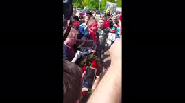 Russian ambassador doused in red paint during visit to war ceremtary in Warsaw