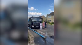 Unique gender reveal sees concrete contractor shoot gallons of blue water from giant pump