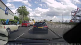 Convertible Mini transporting a boat by putting passenger in the back seat.
