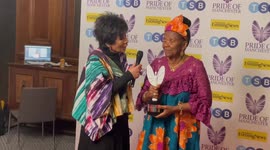 Moira Stuart presents Lydia Ina with Children's Champion Award