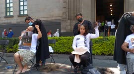 Women shave heads to demand release of family members they say are falsely held in Mexico