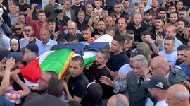 Body of killed Al Jazeera journalist carried through streets of Jenin by mourners