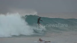 Low front bring large waves (and surfers) to beaches of Florida