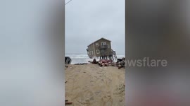 Dramatic video shows the moment an oceanside house valued at $381,200 is swept out to sea in storm
