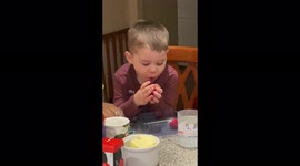 My 4 year old Greatgrandson eating a strawberry