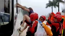 Chinese firefighters rescue stranded passengers after vehicles get trapped in floodwater