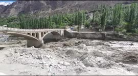 Visuals before the bridge collapse shows powerful waterflow and road closed by administration  - Hunza's Hassanabad bridgedestroyed and swept away by a glacial lake outburst flood in Pakistan