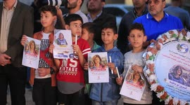 Children light candles as they protest killing of Al Jazeera journalist Shireen Abu Akleh