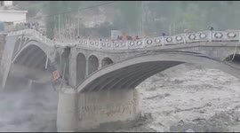 Video shows moment bridge in Pakistan is swept away by massive flood