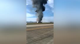 Dozens suffer injuries after passenger plane catches fire during takeoff in China