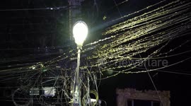 Hundreds of locusts swarm electricity lines after storm in Thailand