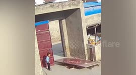 Heavy metal door falls on kids and pet dog 'due to loose screws'