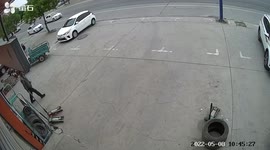 Truck's loose tyre roll across car park in China