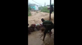 Residents of northern Vietnam work frantically to stop floodwaters from entering homes