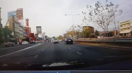 Car switches lanes hitting incoming motorcycle in Thailand