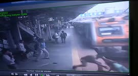 Indian police officer risks life to pull passenger out of path of oncoming train with moments to spare