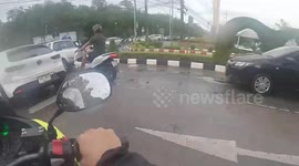 Dozens injured after slipping down oil slick on road in Thailand