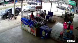Truck's loose wheel crashes into SHOP while people eat