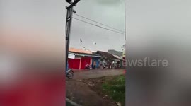 Powerful tornado rips through neighbourhood and damages 90 houses in Indonesia