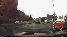 Dashcam footage of a slight collision when a vehicle moves out of a bus lane and hits a car in the other lane.