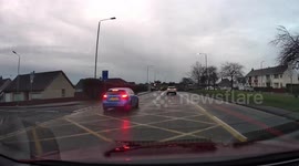 Dashcam footage of a car speeding in a bus lane narrowly missing a cyclist.