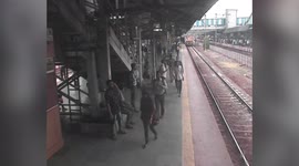 Alert cop pulls passengers out from jaws of death, prevents latter from getting crushed under moving train in western India