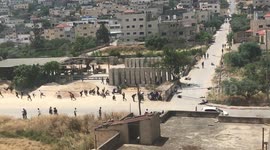 Palestinians and Israeli soldiers clash in the West Bank city of Jenin
