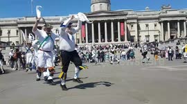 Morris dancers entertain at Trafalgar Square on a gloriously sunny day