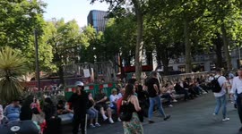 Londoners Soak Up The Hot Weather In Leicester Square In London