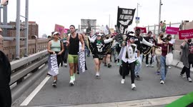 Protesters march across Brooklyn Bridge with banner and t-shirts stating: “Thank God for Abortion”