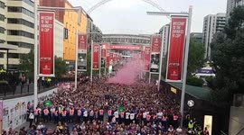 Liverpool and Chelsea football fans leave Wembley Stadium after FA Cup Final