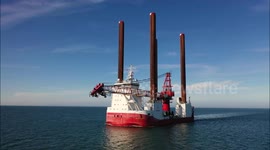Drone captures special jack-up vessel and wind turbine service ship