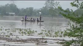 Residents in northeastern India forced to use boats as deadly floods submerge streets