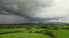 Drone footage shows storm clouds forming in Ireland countryside