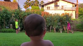 Baby laughs at badminton
