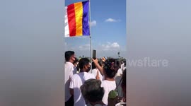 Buddhist monks drop seeds from helicopter for religious day in Cambodia