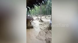 Flash flood wrecks wooden houses in the Philippines