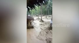 Flash flood wrecks wooden houses in the Philippines