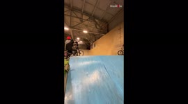 'BMX girl lets go of her bike in mid-air while attempting a cool flip '