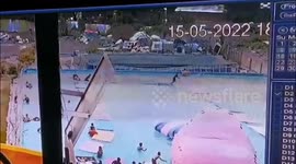 Inflatable waterpark slashed with KNIFE sent tourists scrambling for help and flooded homes