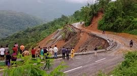Locals forced to navigate across road devastated by landslide in India