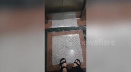 Flood gushes into apartment block lift as Thailand enters annual rainy season