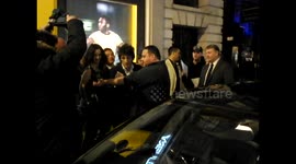 Ronnie Wood signs photographers arm